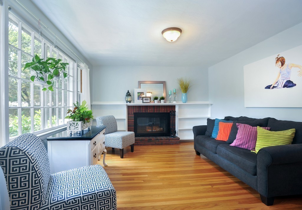 86 Edgemere Road Boston, MA 02132 - Photo 3 of 23 a living room with furniture and a fireplace
