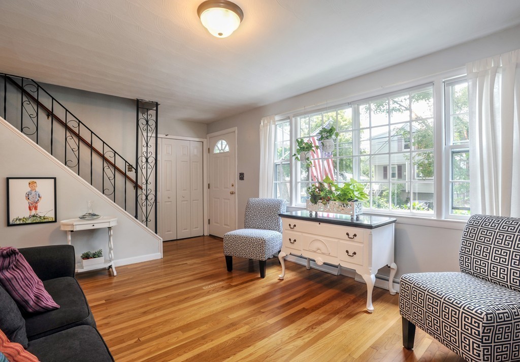 86 Edgemere Road Boston, MA 02132 - Photo 5 of 23 a living room with furniture and a large window