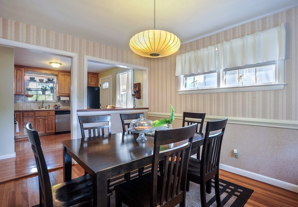 86 Edgemere Road Boston, MA 02132 - Photo 6 of 23 a view of a dining room with furniture window and wooden floor