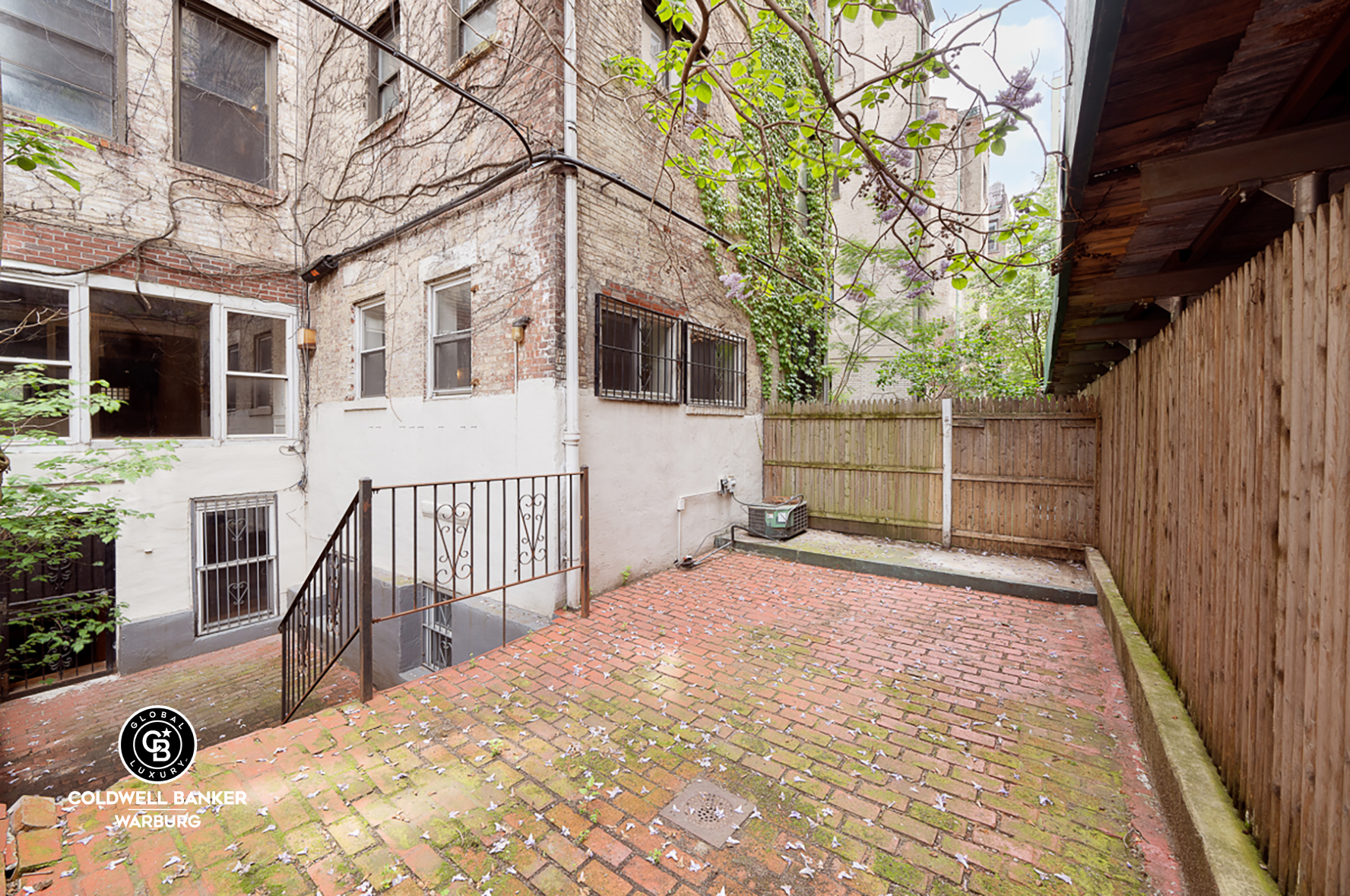 18 West 76th Street Manhattan, NY 10023 - Photo 15 of 19 a view of a house with a snow in the yard