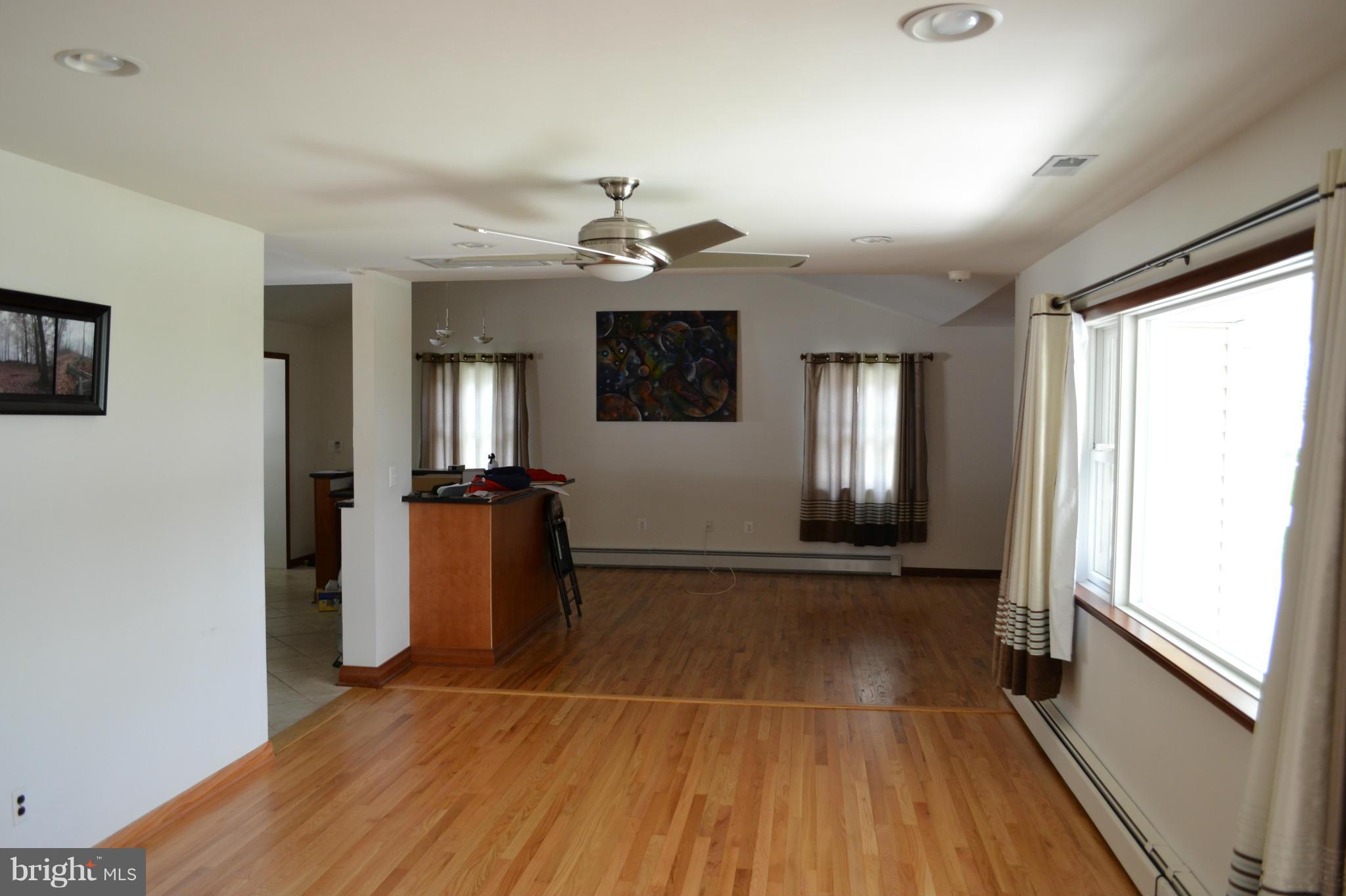442 Andover Road Linthicum Heights, MD 21090 - Photo 5 of 8 wooden floor in an empty room with a window