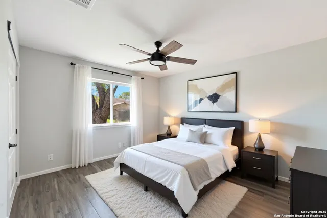 a bedroom with bed and window