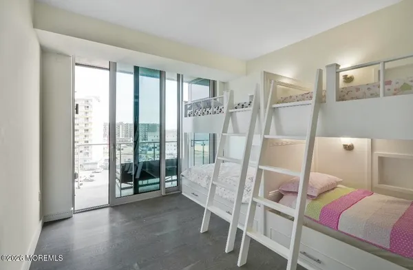 a bed room with a bed and glass door