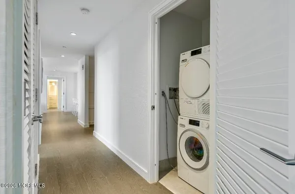 a view of a hallway with washer and dryer