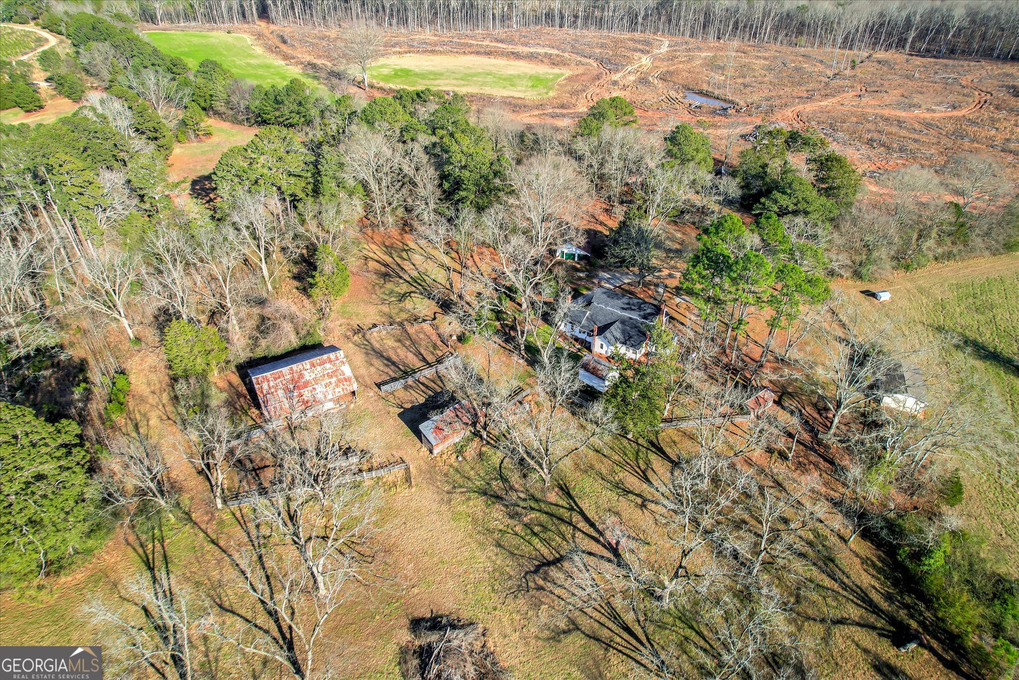 267 Garrard Road Washington, GA 30673 - Photo 11 of 74 a view of a swimming pool with an outdoor space and trees all around