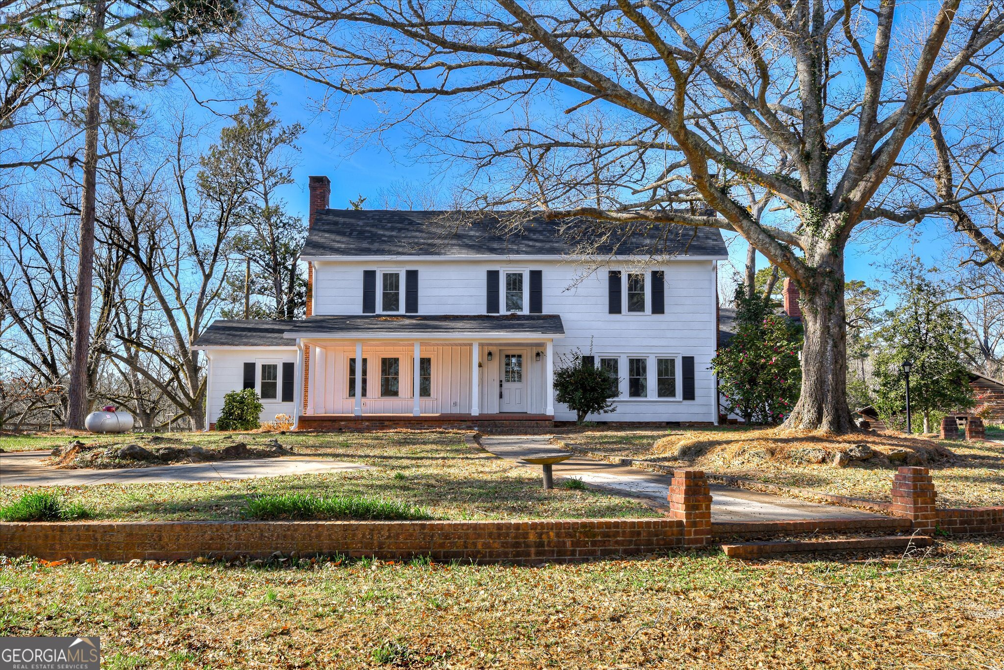 267 Garrard Road Washington, GA 30673 - Photo 17 of 74 a front view of a house with a yard