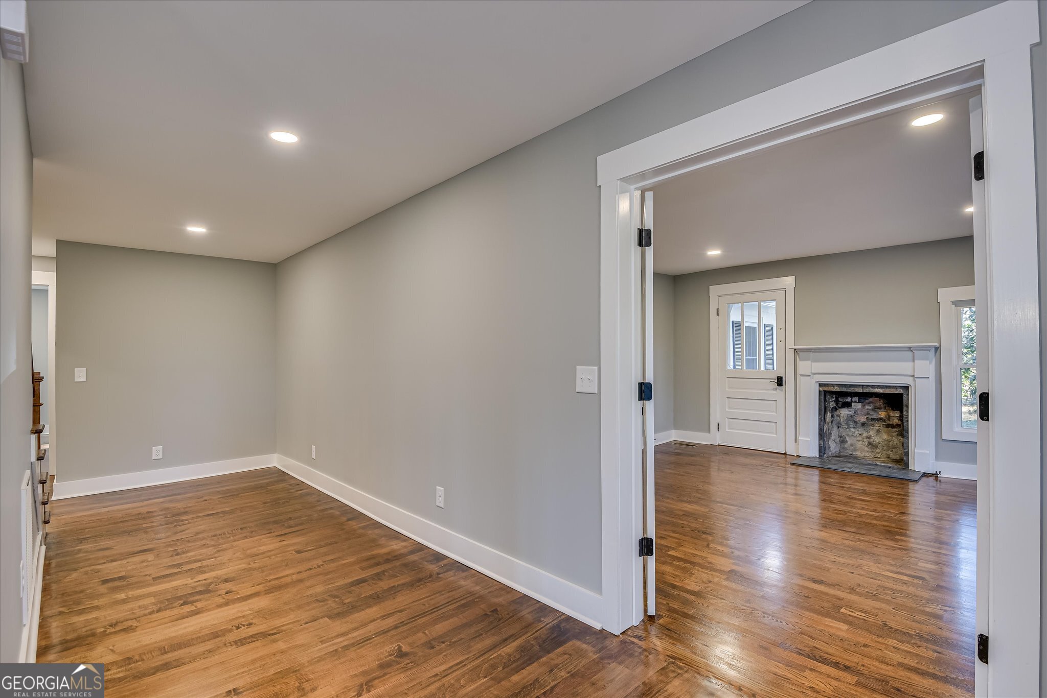 267 Garrard Road Washington, GA 30673 - Photo 20 of 74 a view of empty room with wooden floor and fireplace