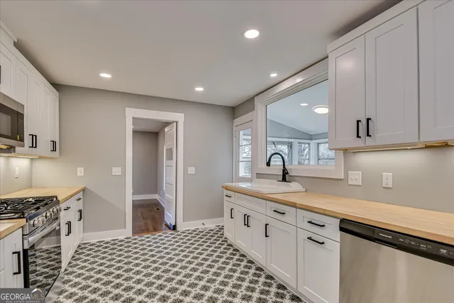 a view of washer and dryer with wooden floor