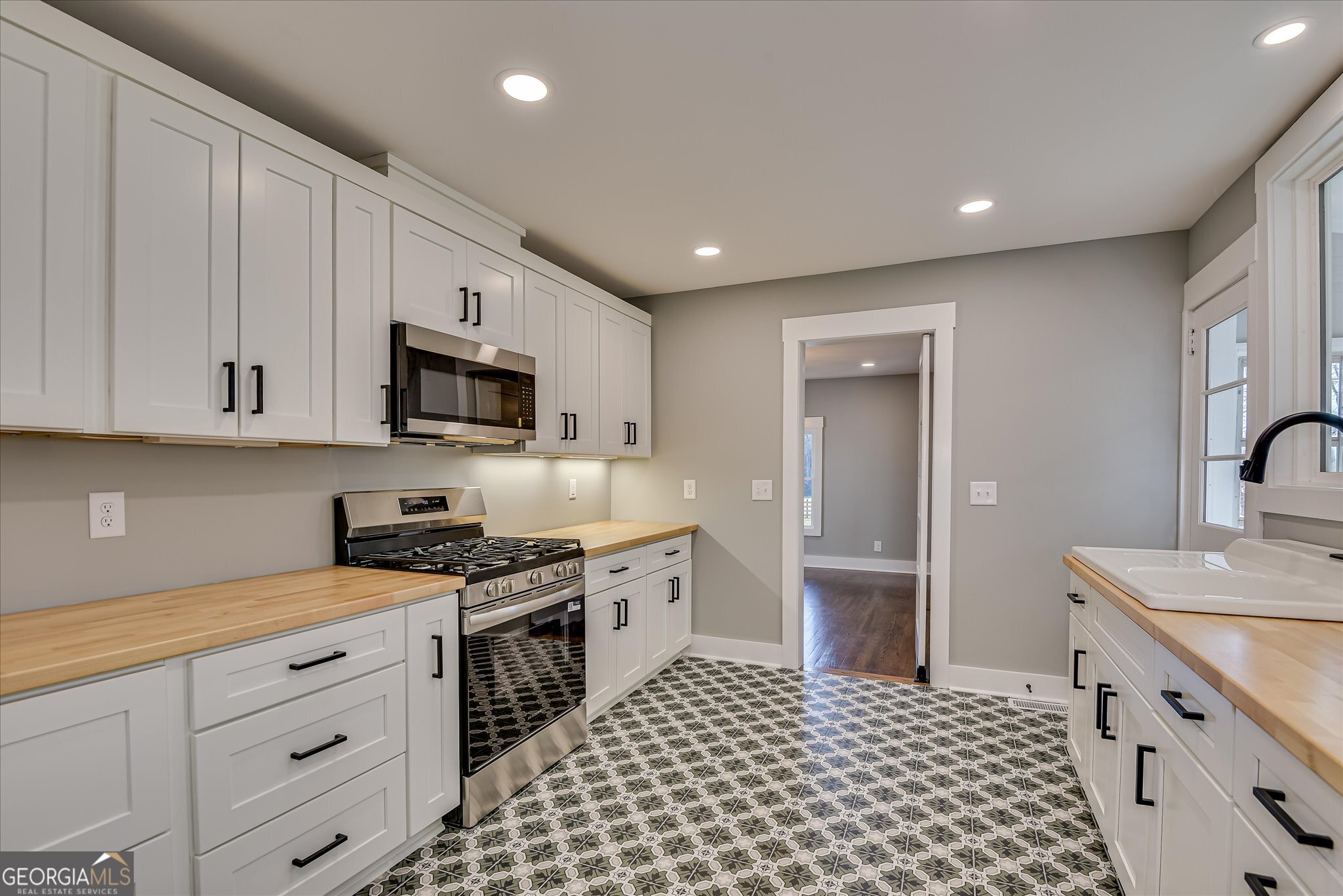 267 Garrard Road Washington, GA 30673 - Photo 30 of 74 a kitchen with stainless steel appliances a refrigerator sink and cabinets