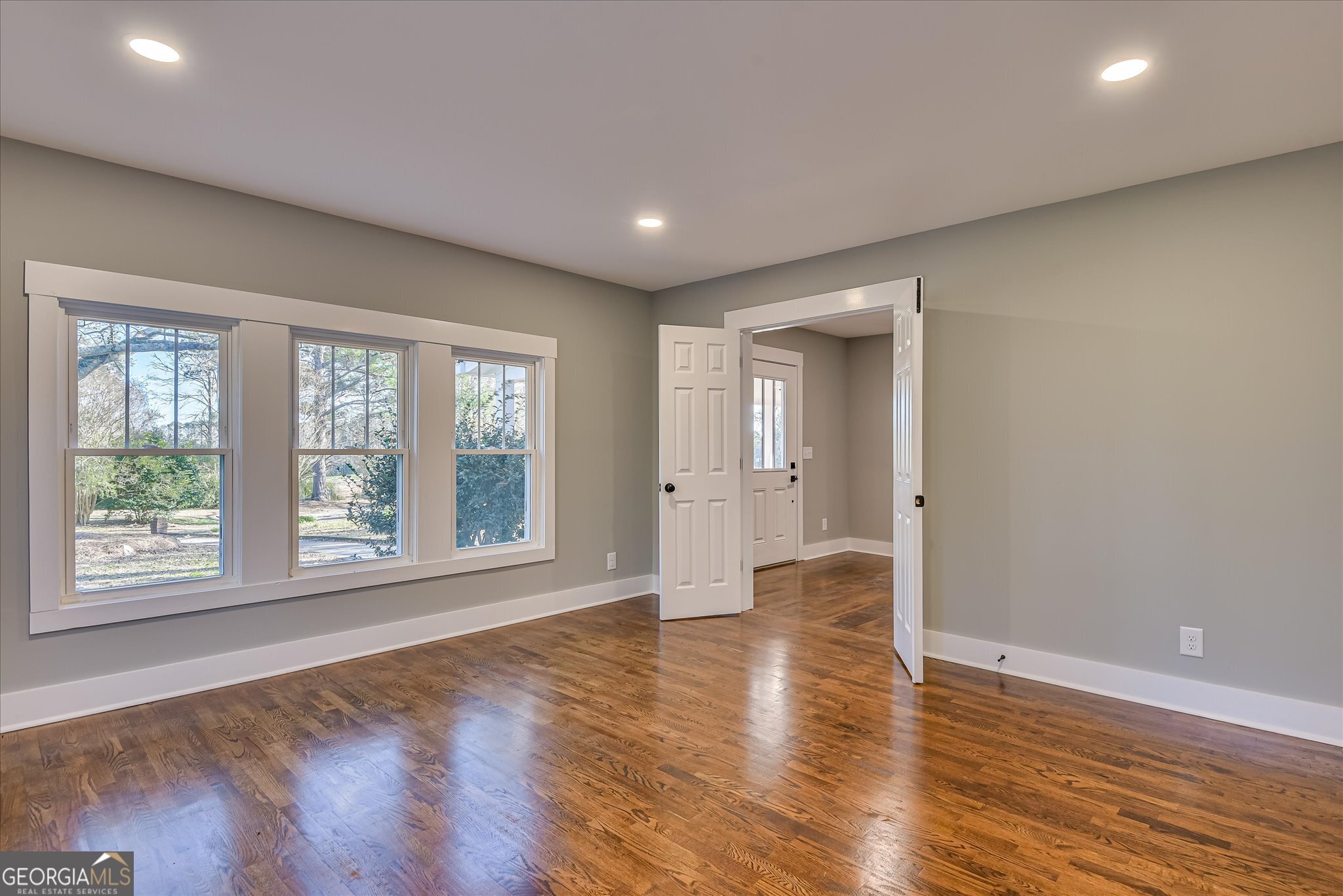267 Garrard Road Washington, GA 30673 - Photo 33 of 74 a view of an empty room with wooden floor and a window