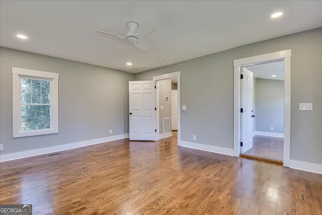 a front view of house with yard barbeque and outdoor seating