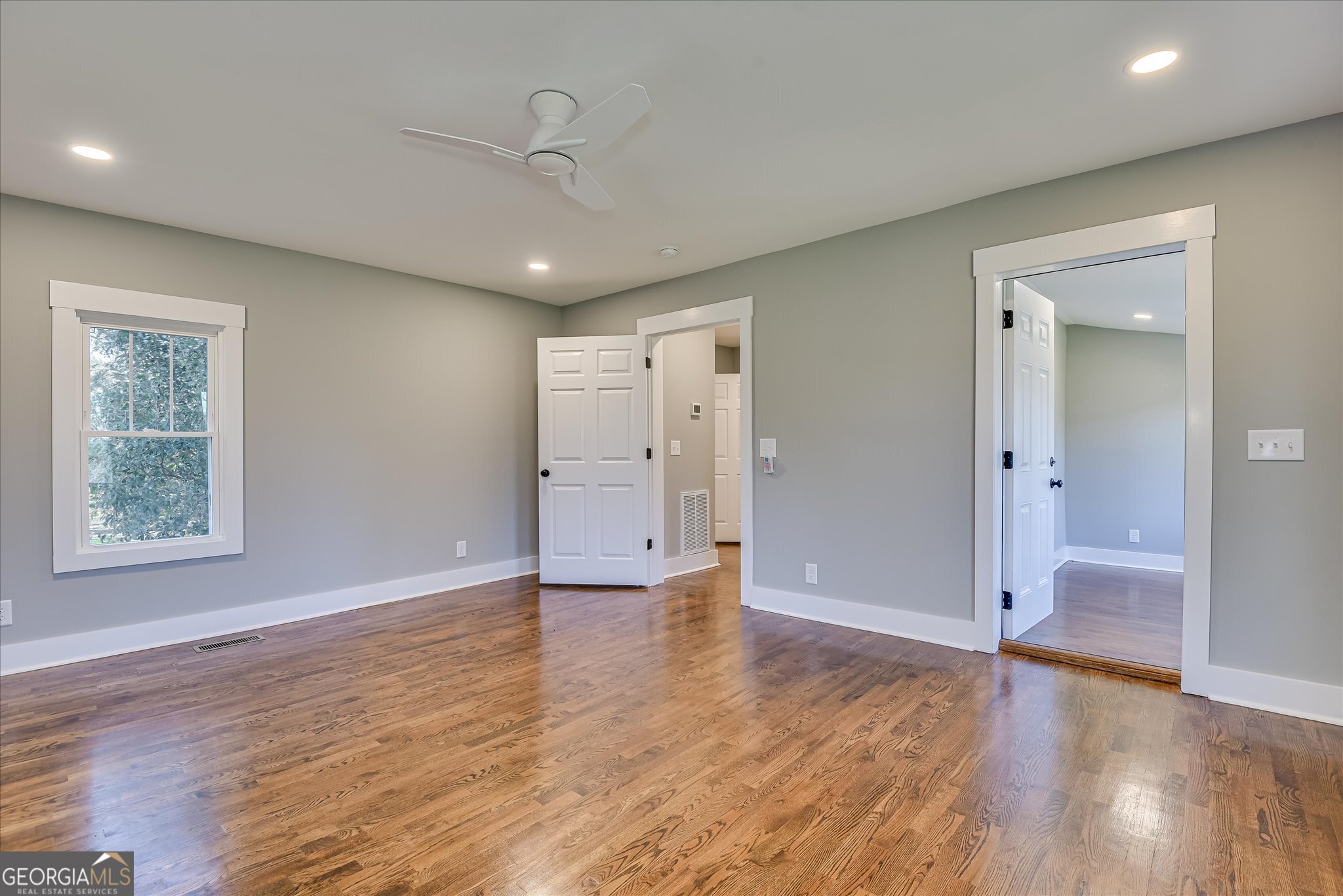 267 Garrard Road Washington, GA 30673 - Photo 39 of 74 an empty room with wooden floor and windows