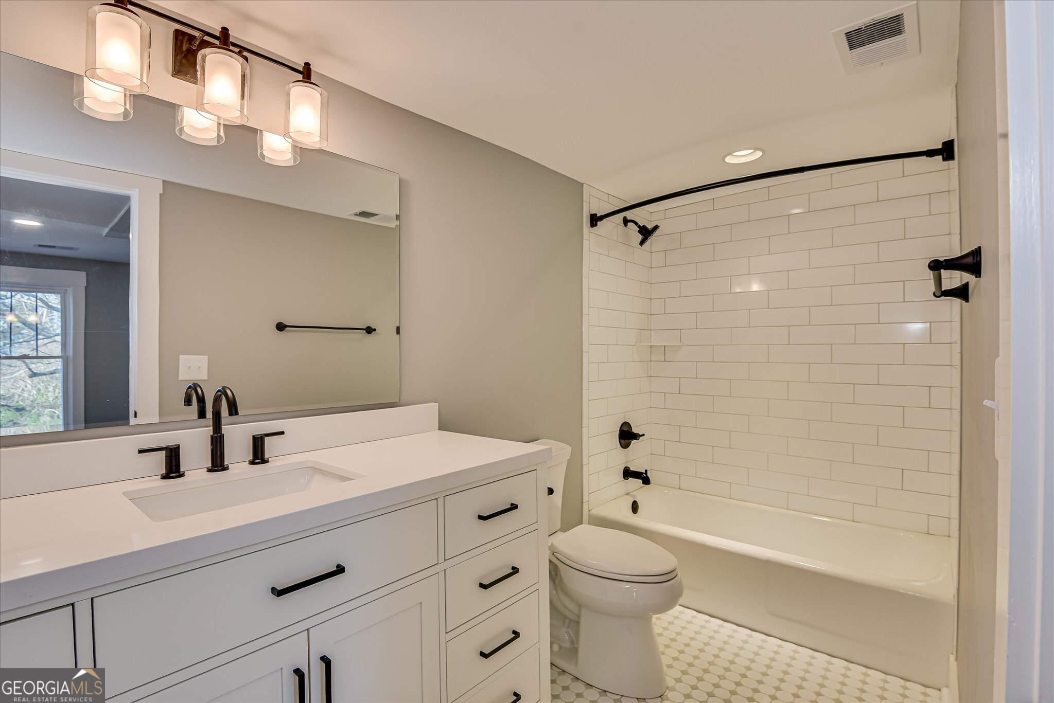 267 Garrard Road Washington, GA 30673 - Photo 50 of 74 a bathroom with a sink a toilet a mirror and shower