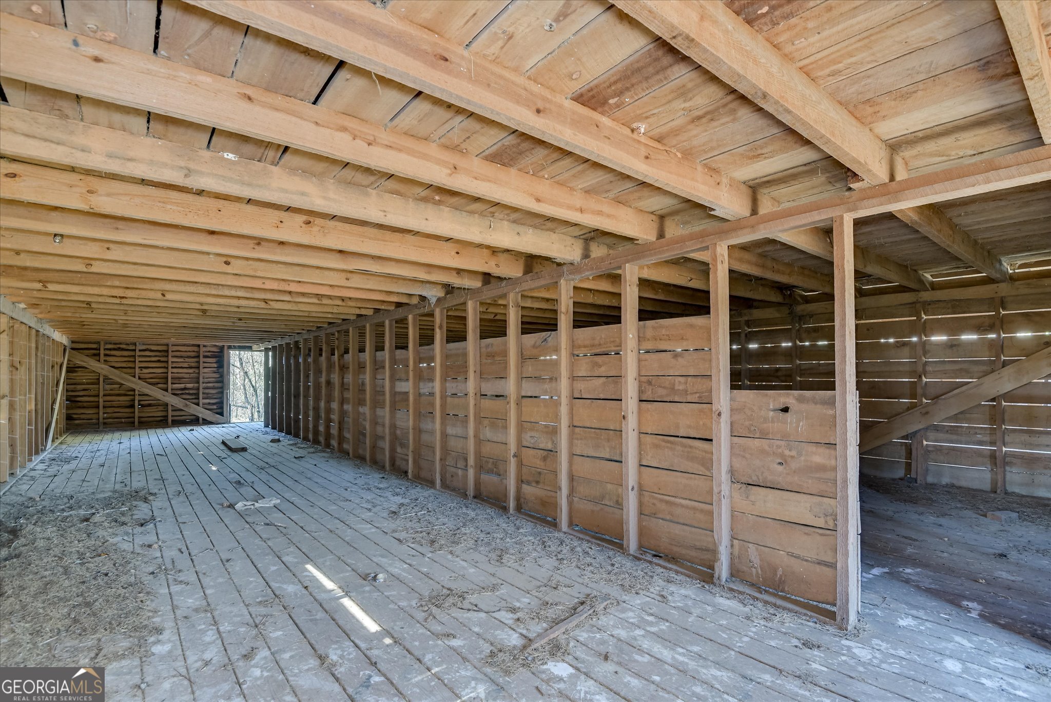 267 Garrard Road Washington, GA 30673 - Photo 63 of 74 a view of an empty room with wooden floor