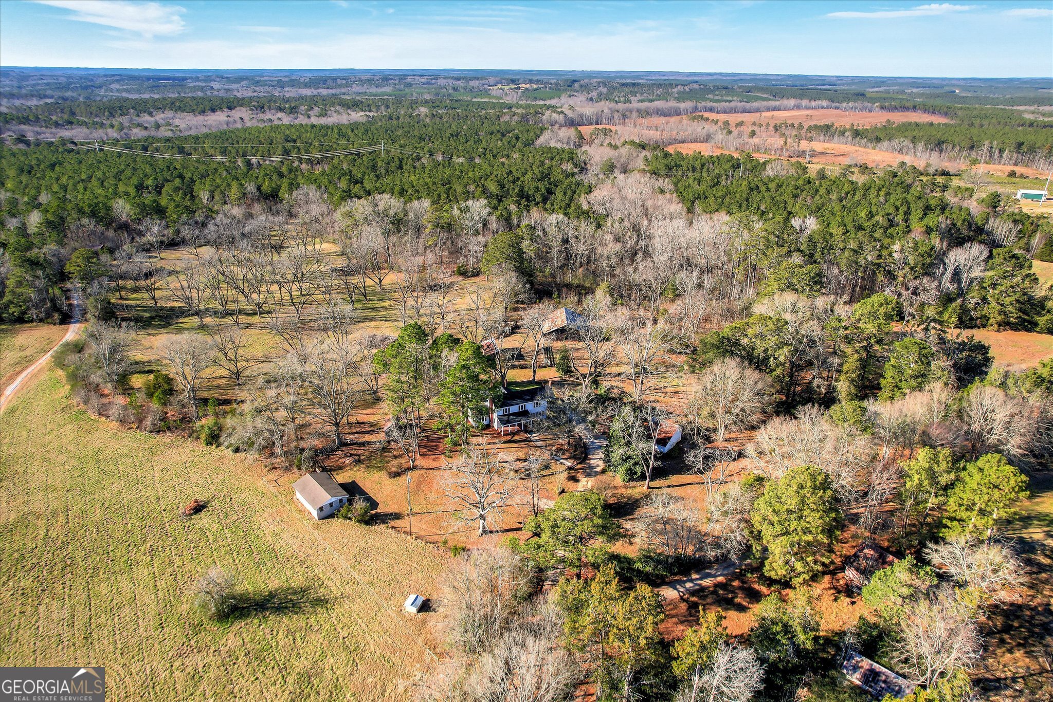267 Garrard Road Washington, GA 30673 - Photo 7 of 74 View from above of the barns and sheds along the back of the property