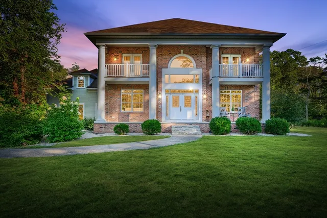 a front view of a house with a yard
