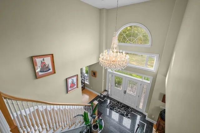 a view of hall way with furniture