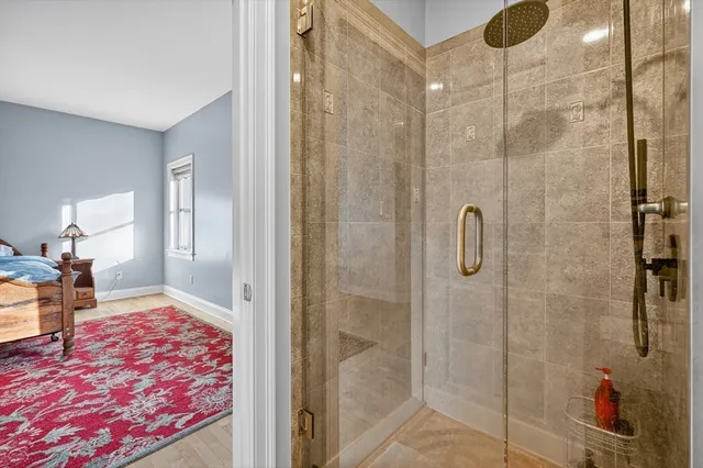 a bedroom with a bed and a mirror