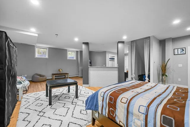 a bedroom with a bed and a table in it