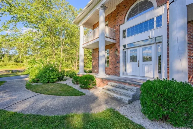 a view of a building with a yard