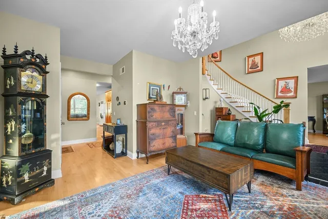 a bedroom with furniture and a wooden floor