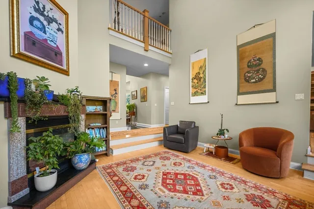 a living room with furniture and flowers