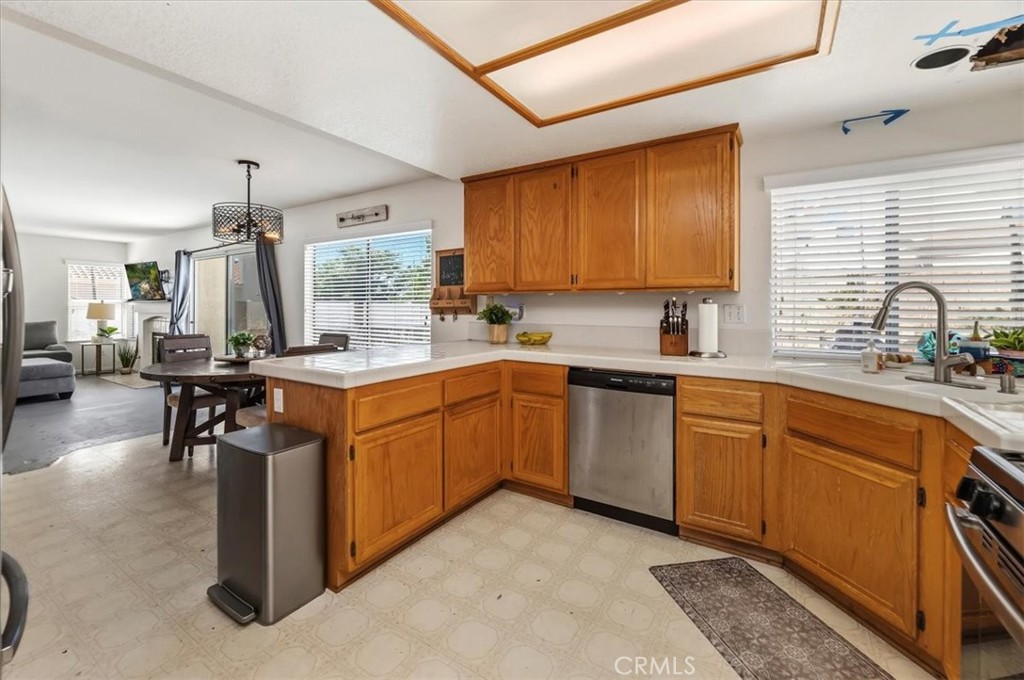 352 Leafwood Court Riverside, CA 92506 - Photo 16 of 42 a kitchen with a sink stove and cabinets