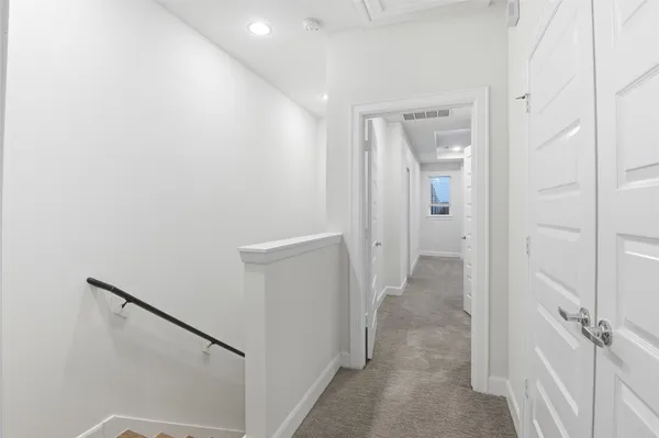a view of a hallway with closet