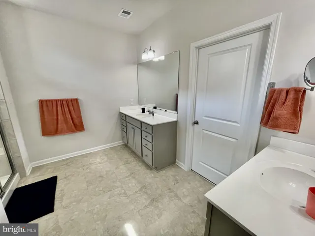 a bathroom with a sink toilet and tub