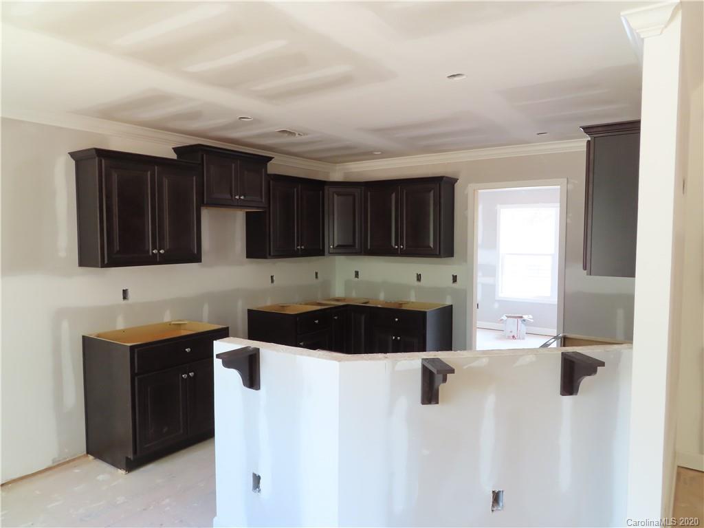 2219 Cedar Road York, SC 29745 - Photo 7 of 14 a kitchen with stainless steel appliances a stove a sink a microwave a refrigerator and cabinets