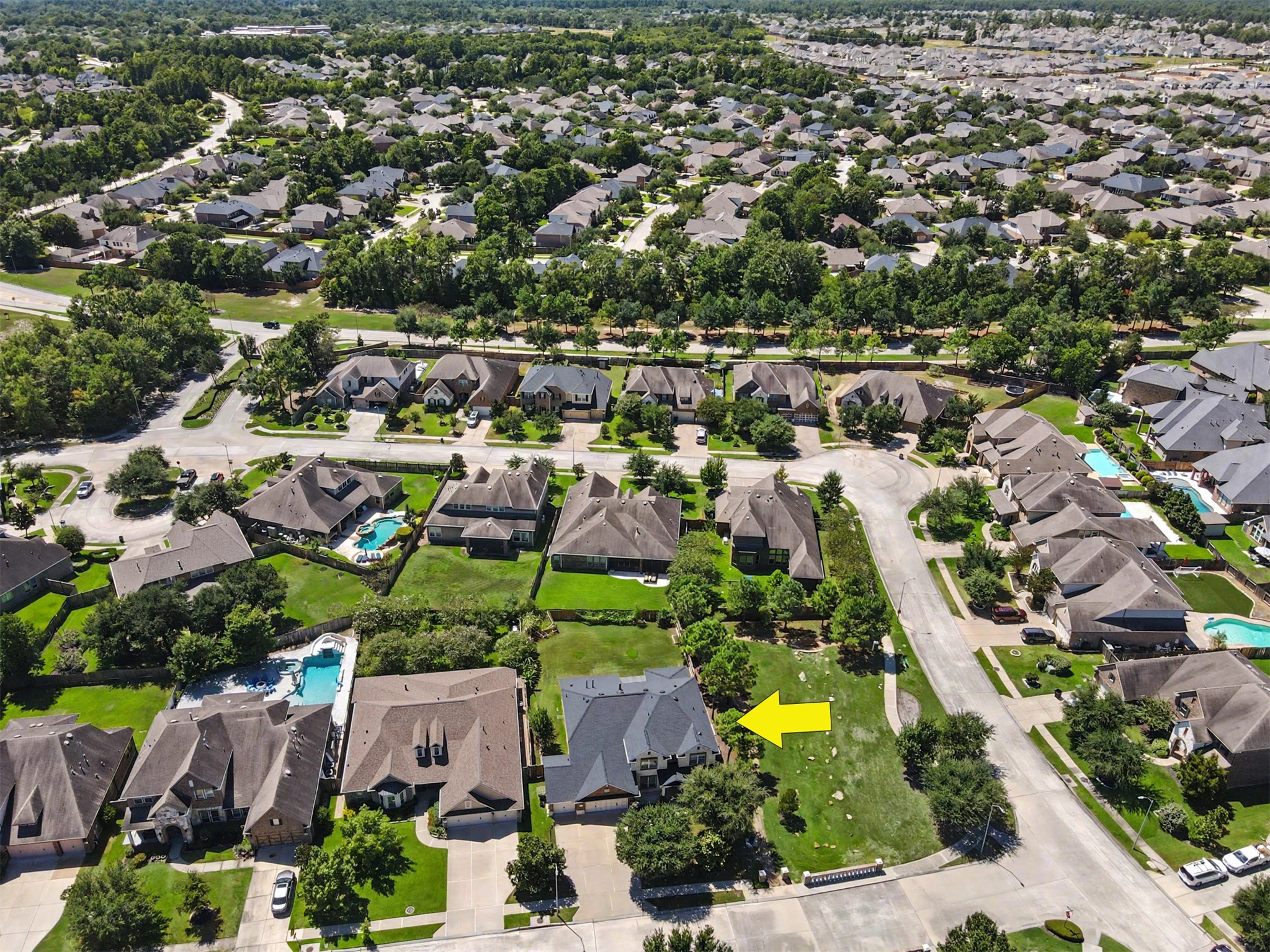 31325 Riley Woods Court Spring, TX 77386 - Photo 43 of 50 Aerial view highlights the home’s location within The Falls at Imperial Oaks and its proximity to neighborhood green space.