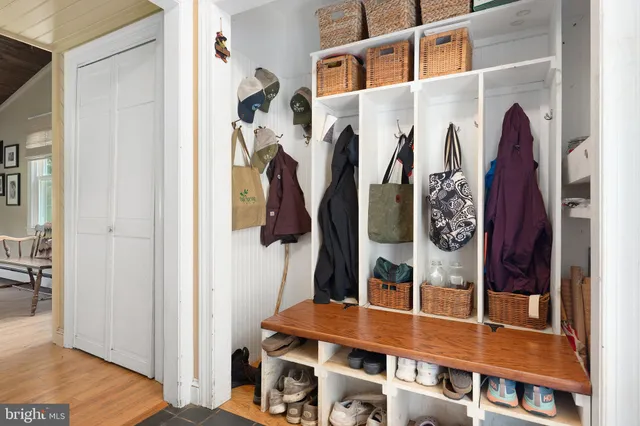 a bedroom with a bed and flat screen tv