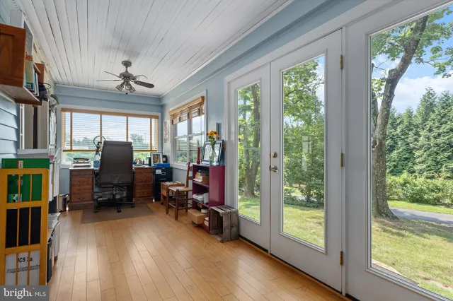 a view of a house with a yard and sitting area