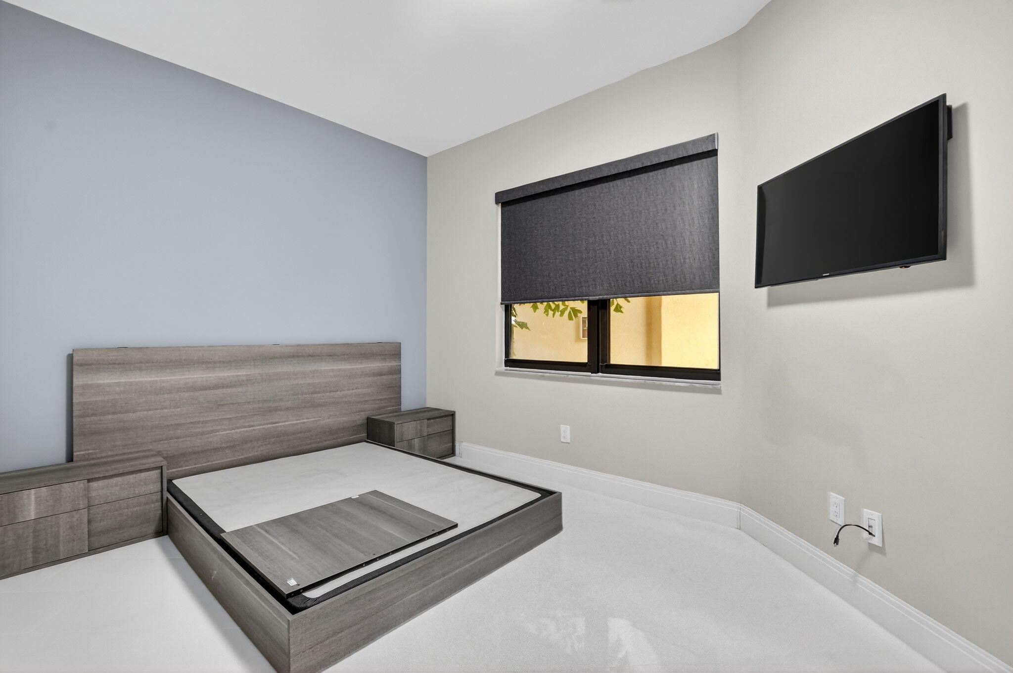 7535 La Paz Boulevard, Unit 105 Boca Raton, FL 33433 - Photo 30 of 54 a living room with a flat screen tv