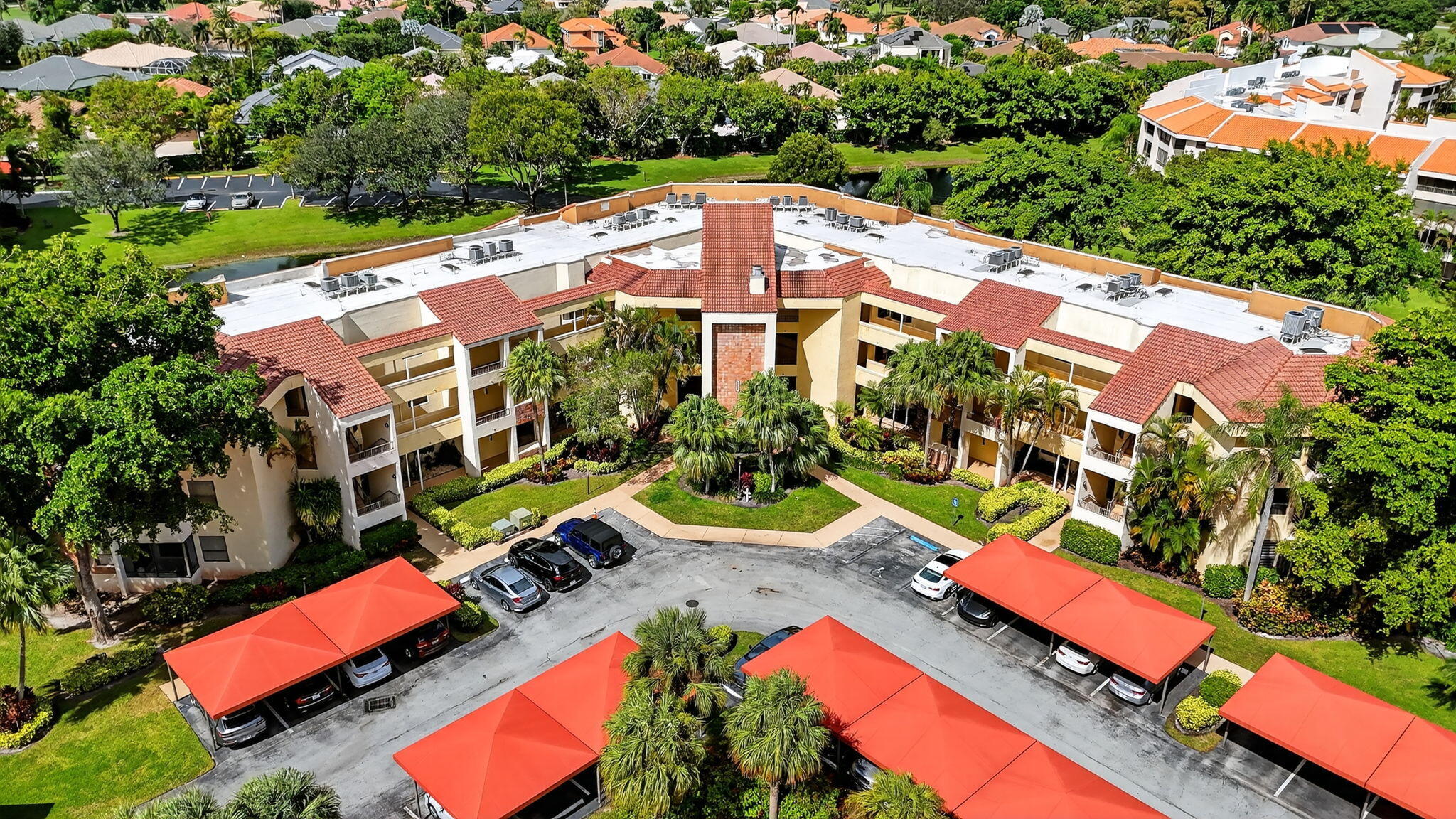 7535 La Paz Boulevard, Unit 105 Boca Raton, FL 33433 - Photo 38 of 54 an aerial view of residential houses with outdoor space