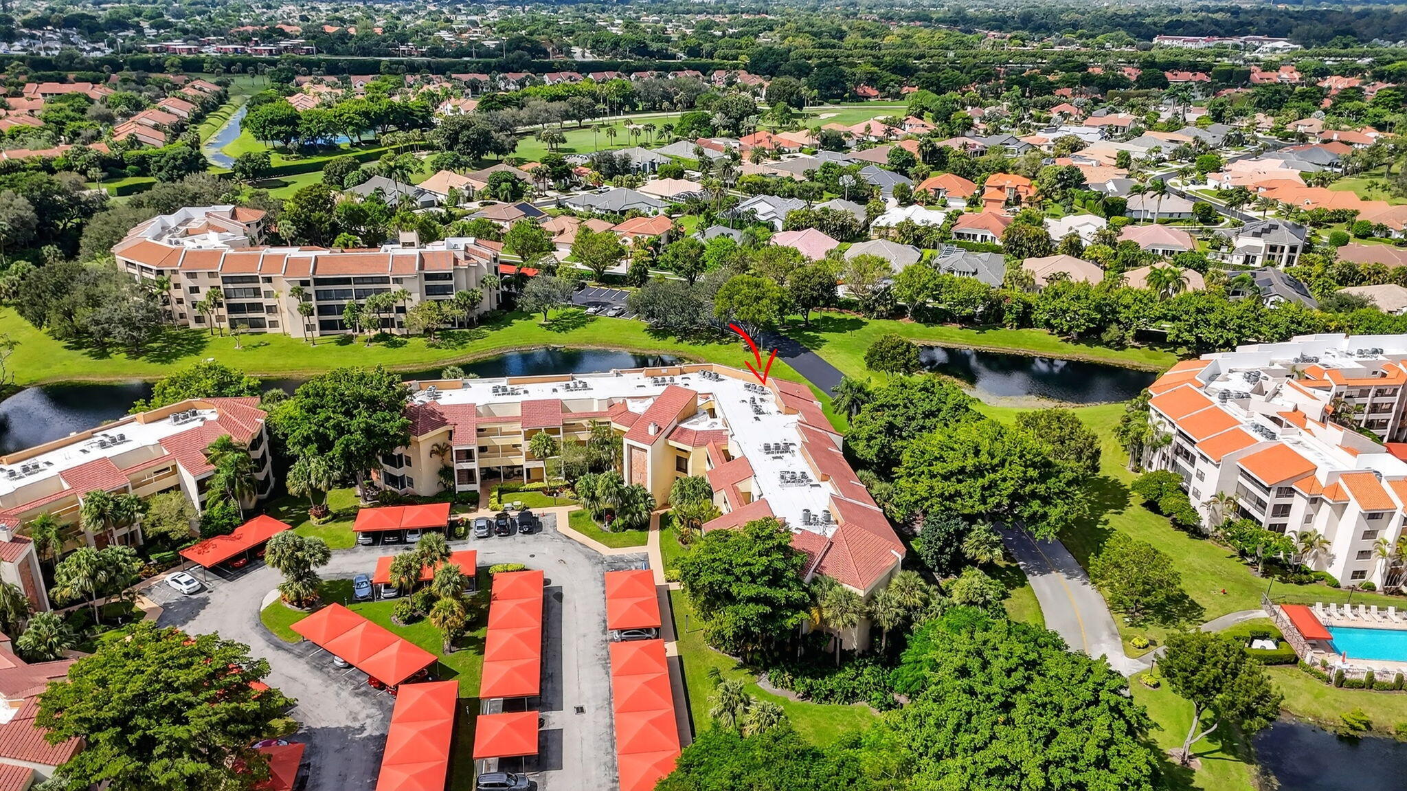 7535 La Paz Boulevard, Unit 105 Boca Raton, FL 33433 - Photo 47 of 54 an aerial view of residential houses with outdoor space and swimming pool