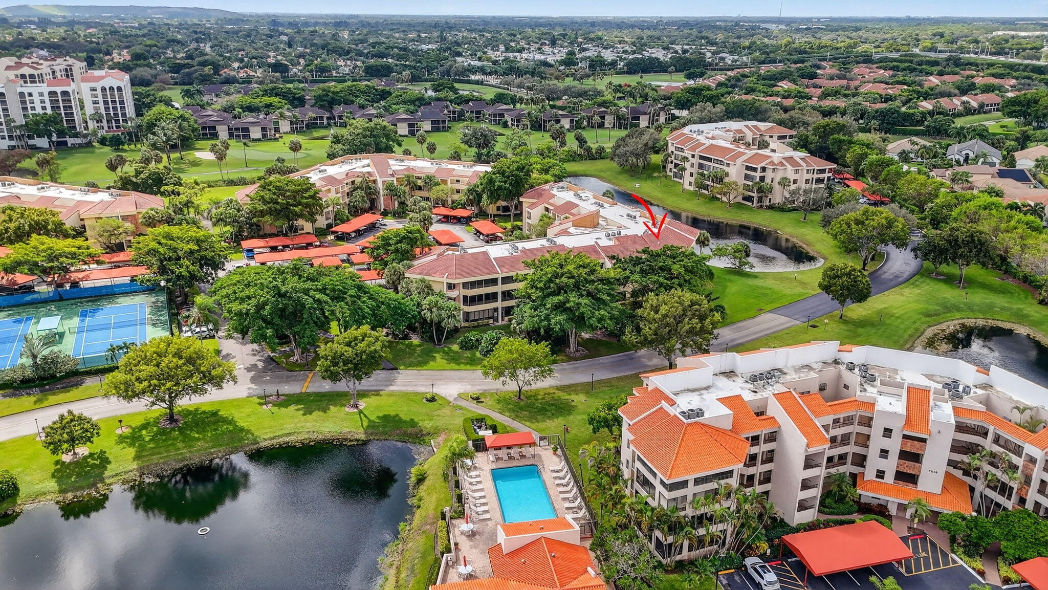7535 La Paz Boulevard, Unit 105 Boca Raton, FL 33433 - Photo 48 of 54 an aerial view of residential houses with outdoor space and swimming pool