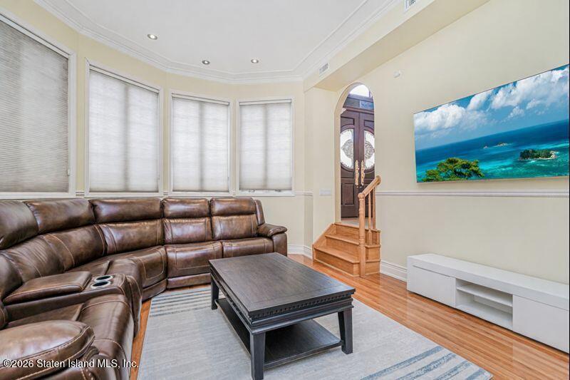5125 Amboy Road Staten Island, NY 10312 - Photo 12 of 33 a living room with furniture a rug and white walls