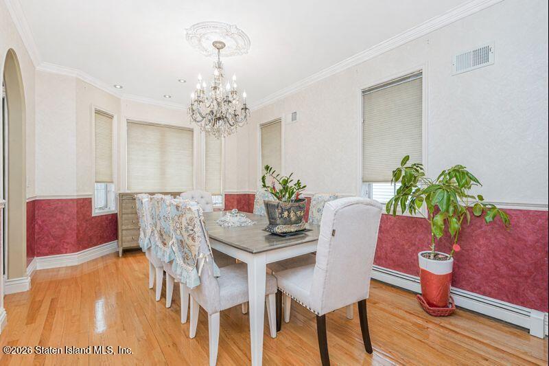 5125 Amboy Road Staten Island, NY 10312 - Photo 14 of 33 a view of a dining room with furniture and wooden floor