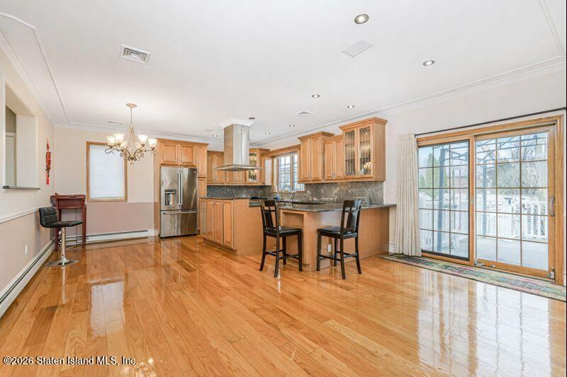 5125 Amboy Road Staten Island, NY 10312 - Photo 19 of 33 a view of a kitchen with dining table and chairs