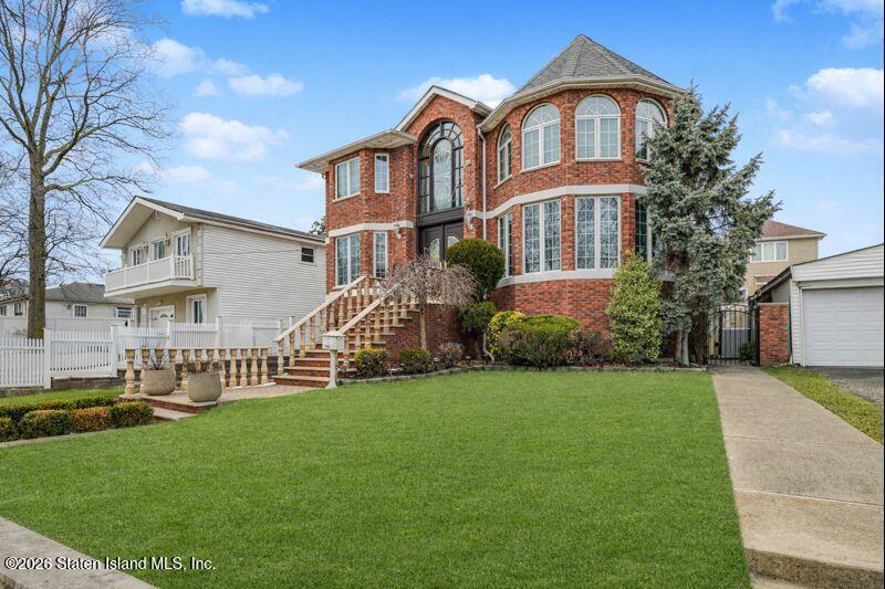 5125 Amboy Road Staten Island, NY 10312 - Photo 2 of 33 a front view of a house with garden