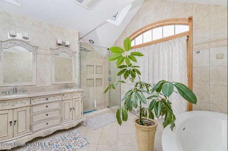 5125 Amboy Road Staten Island, NY 10312 - Photo 29 of 33 a white vase with white and yellow flowers