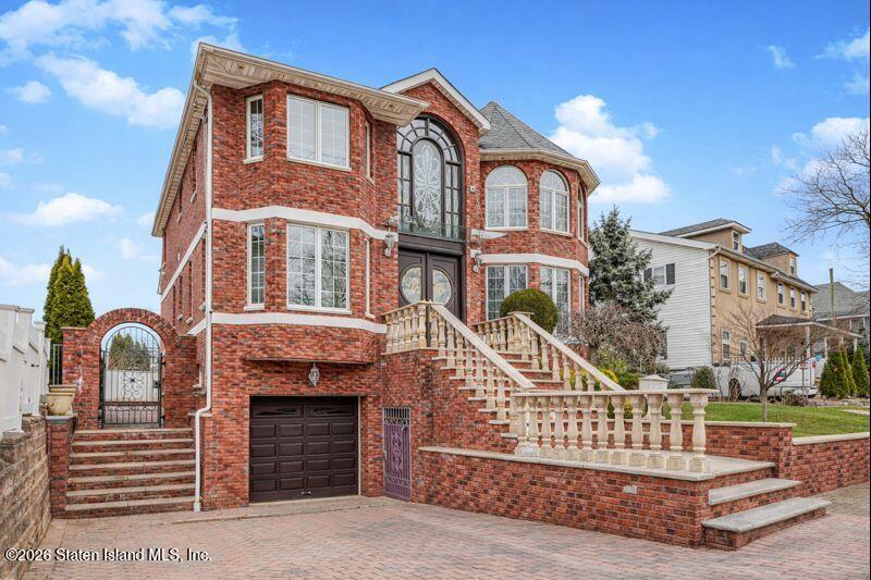 5125 Amboy Road Staten Island, NY 10312 - Photo 3 of 33 a front view of a house with a garden
