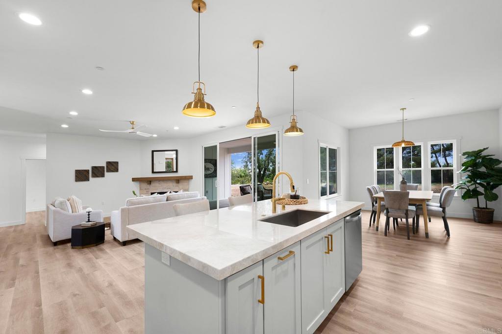 1547 Dickey Street Fallbrook, CA 92028 - Photo 15 of 45 a large kitchen with kitchen island a large island in it