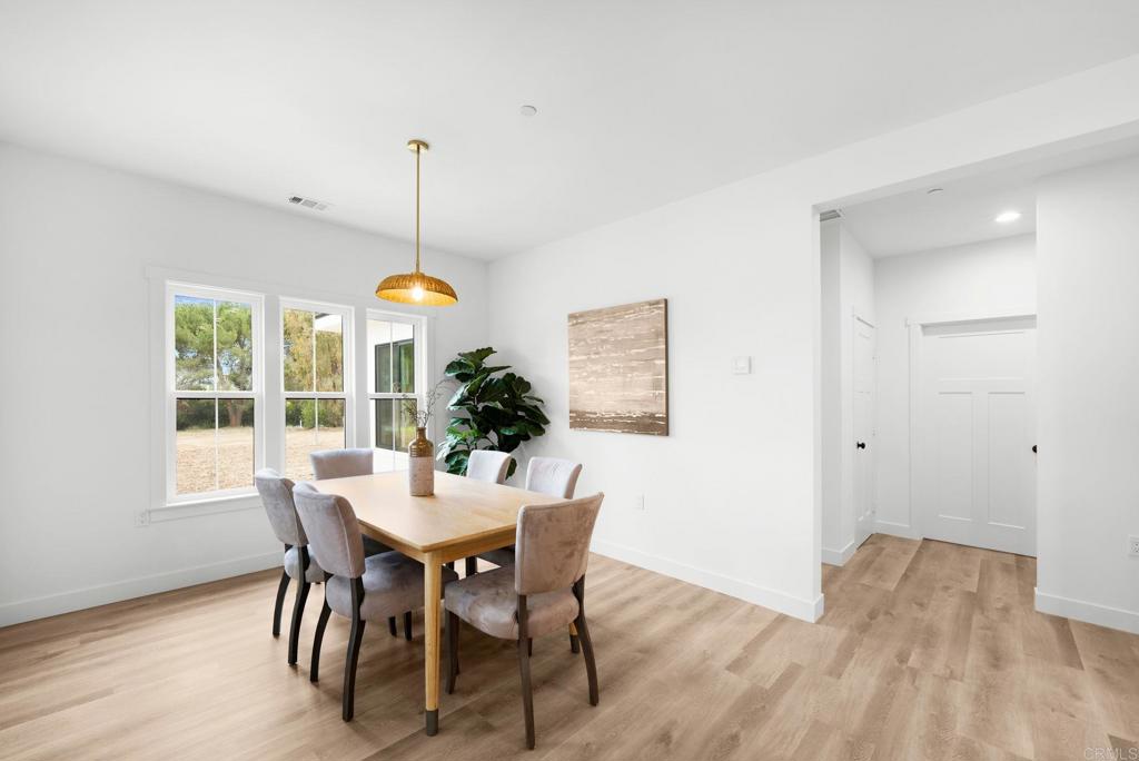 1547 Dickey Street Fallbrook, CA 92028 - Photo 18 of 45 a dining room with furniture window and wooden floor