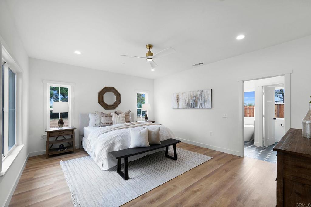 1547 Dickey Street Fallbrook, CA 92028 - Photo 20 of 45 a bed room with a bed and a lamp
