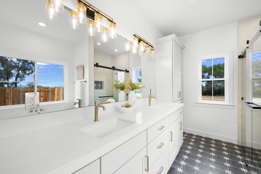 1547 Dickey Street Fallbrook, CA 92028 - Photo 25 of 45 a bathroom with a sink and a mirror