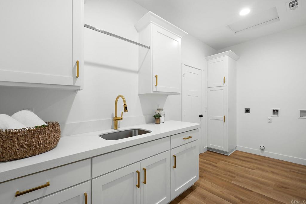 1547 Dickey Street Fallbrook, CA 92028 - Photo 30 of 45 a kitchen with a sink and cabinets
