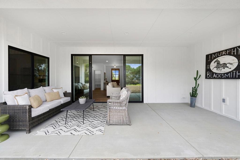 1547 Dickey Street Fallbrook, CA 92028 - Photo 39 of 45 a living room with furniture and a flat screen tv