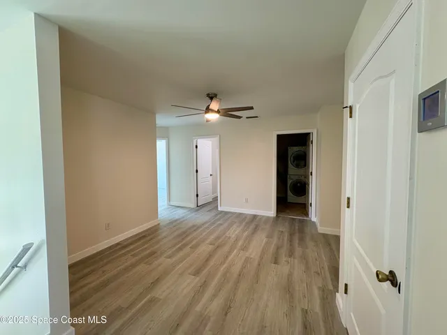 a view of a livingroom with wooden floor